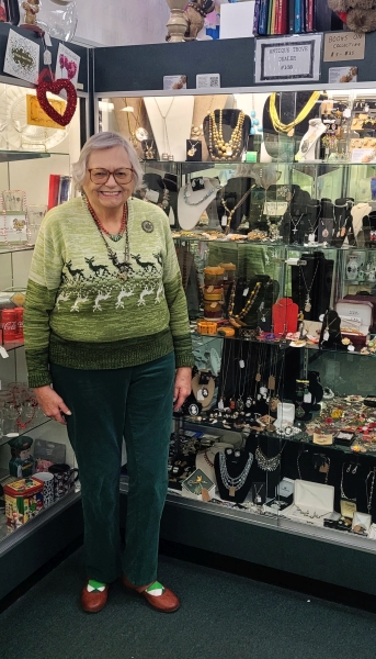 Charleene at her case at Antique Trove